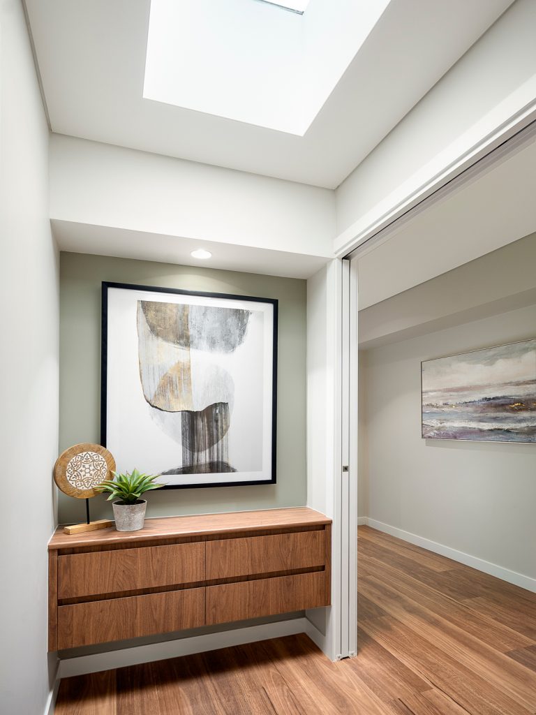 Sustainable-and-eco-friendly-Sherwood-home-by-dion-Deminara-architecture-masters-bedroom-entrance-with-console-table-or-cabinets