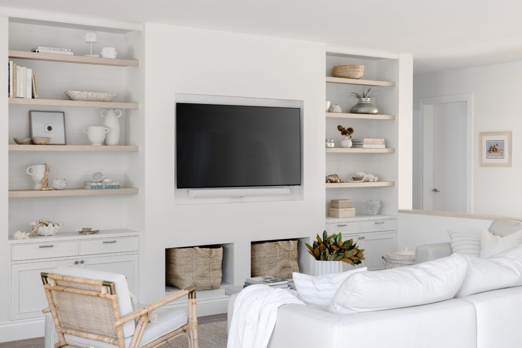 Darren-james-interiors-gold-coast-home-living-area-with-television-sofas-or-seating-area-and-display-shelves