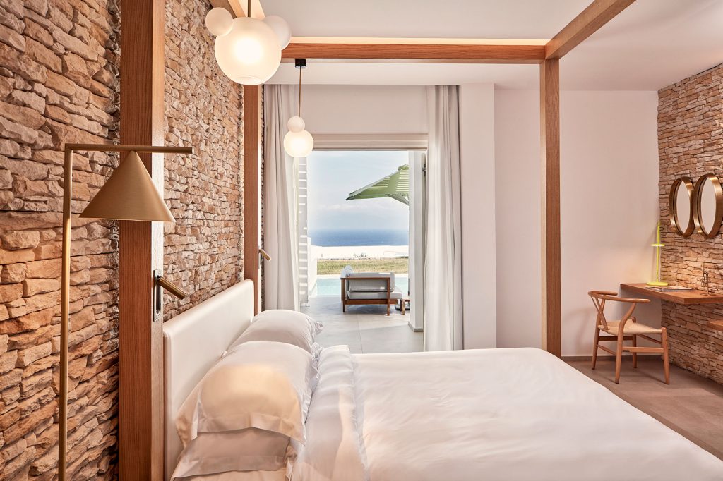 Naia Mykonos - bedroom with views of the beach